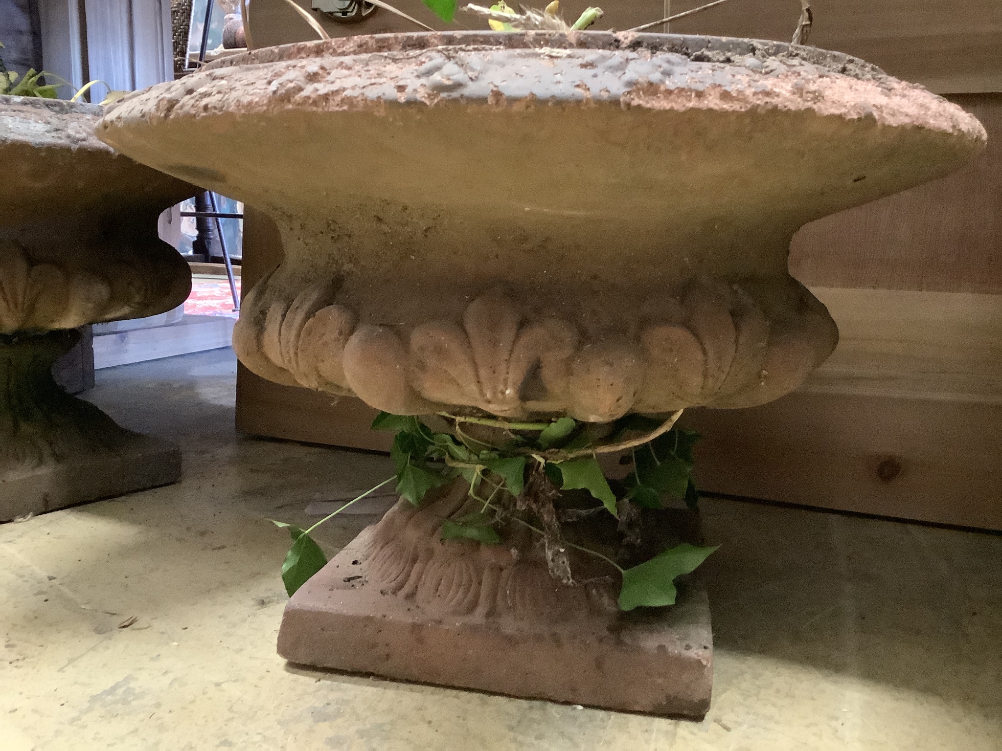 A pair of terracotta campana garden urns, diameter 44cm, height 30cm